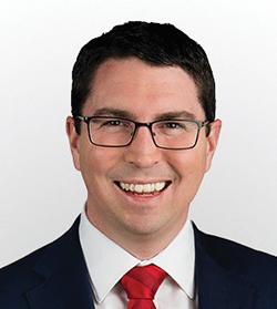 The Hon Patrick Gorman MP smiling at the camera